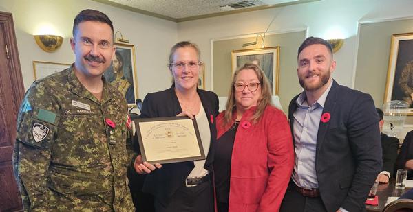 Sophie Martel is presented a certificate by Neil Marshall, chapter past president; alongside Kelly Stewart-Belisle regional vice president, Canada Region; and Cameron Greer of Zscaler, at the November event.