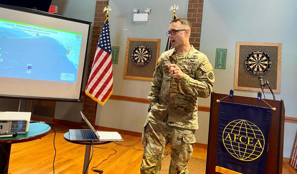 Col. Burroughs presents information on the I Corps distributed mission command framework during the chapter luncheon at the McChord Club, Joint Base Lewis-McChord, Washington.