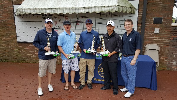 Col. Stamatis Smeltz, USAF, U.S. Air Forces Central Command A-6 (r), presents trophies and prizes at the May tournament to first-place winners (l-r) Eric Fox; Senior Master Sgt. Steven Wisecarver, USAF; Airman 1st Class William Kelbaugh, USAF; and Senior Airman Daniel Yi, USAF. 