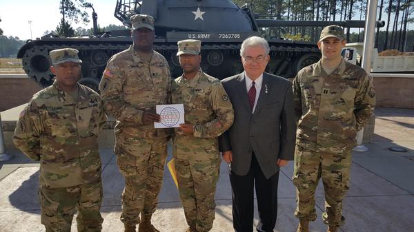 Attending the presentation to Sgt. VonAaron Green, USAF, in front of U.S. Army Central Headquarters, Patton Hall, Shaw Air Force Base, SC, are (l-r) Sgt. Maj. Michael O. Lewis, USAF, senior Army spectrum manager, USARCENT G-6; presenter and Chapter President Lt. Col. Dwyke A. Bidjou, USAF; awardee Sgt. VonAaron Green, USAF, USARCENT G-6; James Crawford, chapter vice president; and Capt. James Cole, USAF, flight commander, USAFCENT Plans and Programs and chapter second vice president.