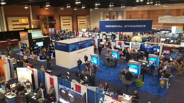 Vendors at AFCEA's TechNet Augusta explain their technologies to attendees of the August conference in Georgia. The chapter provided volunteer support for the event to the Fort Gordon Chapter and Col. Patricia J. Harrington, USAF (Ret.), AFCEA regional vice president, Georgia region.