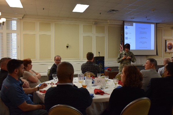 Gen. Crider fields questions during the January luncheon from corporate members at the CACI table. 