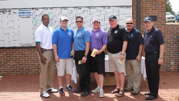 Col. Crooks (l) recognizes the second-place team at the March tournament: Nick Fairhurst, Brad Gomillion, Doug McCoppin and Mark Duda. Sgt. Tuggle (2nd from r) and Gen. Basla are on hand to congratulate them. 