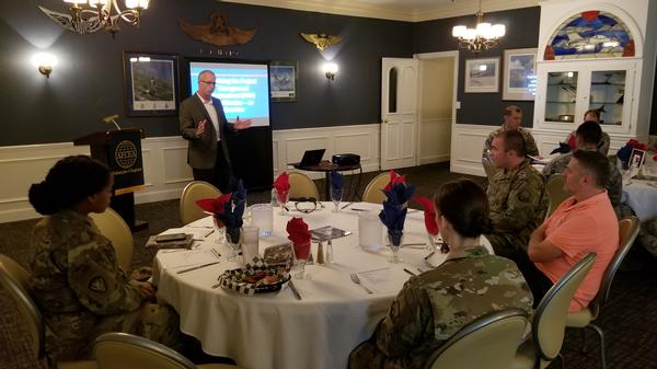 Shenberger answers questions about preparing for PMP certification at the August Lunch and Learn from service members with the U.S. Air Forces Central Command, U.S. Army Central and the 20th Communications Squadron at Shaw Air Force Base.