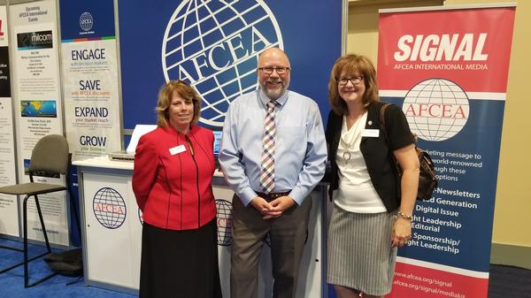 AFCEA International's (l-r) Sandy Campbell, Sean McGowan and Susan Emert sign up new members at the August conference.