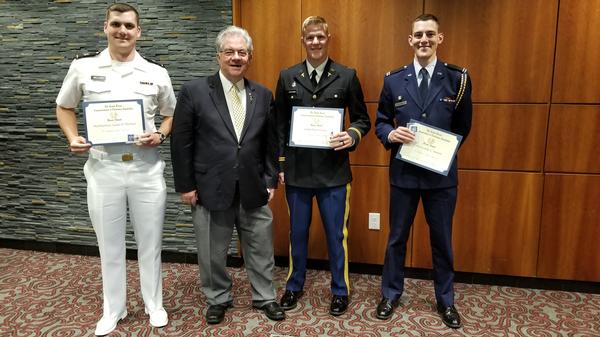 Jim Crawford (center l), chapter director of member services, congratulates award winners (l-r) Midshipman Adam D. Wellner, Army Cadet Peter Leichner and Air Force Cadet Austin C. Horton after the April ceremony. Midshipman Wellner is off to NAS Pensacola, Florida; Cadet Lecihner will attend medical school to become an Army doctor; and Cadet Horton is going to flight school. The chapter wishes them all the best in their new careers. 