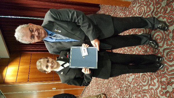 Chapter Vice President James M. Crawford presents an AFCEA International Scholastic Award to Midshipman Sandra V. Jordan at the 2017 Spring ROTC Awards Ceremony in March.