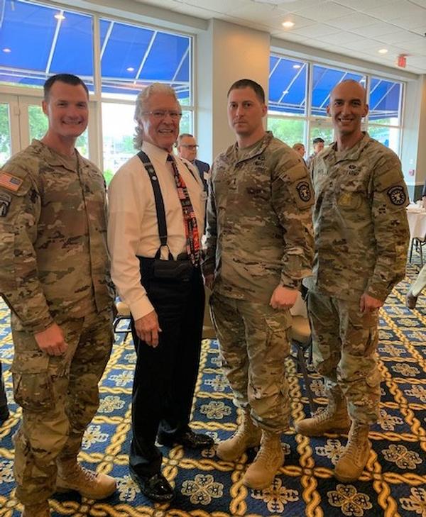 U.S. Army Recruiting Command members join chapter members for the April meeting. (From l-r) 1st Sgt. James Stosh, USA; Robert Foster, chapter vice president of Publicity; 1st Lt. Jason Martin, USA; and Sgt. 1st Class Stephen Smith.