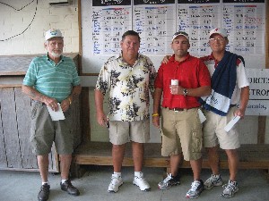 Michael McCray (l), Buck Carter (2nd from l), Eric Bird (2nd from r) and Danny Fortson take third place in the golf tournament and fundraiser, held in October.