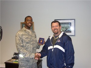 Capt. Alfonza Howard, USAF (r), flight commander, plans and resources, 305th Communications Squadron, McGuire Air Force Base, New Jersey, receives a token of appreciation from Rob Corey, chapter vice president, for speaking to the chapter in April. Capt. Howard also serves on the chapter's executive committee.