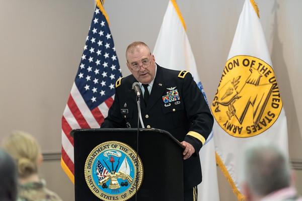 Brig. Gen. Wilbur Wolf, USA (Ret.), presents a 