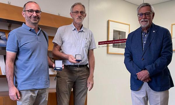 In July, Rear Adm. Carlos Rodolfo, PRT NA (Ret.), regional vice president, Atlantic Region (r), gathers at the Faculty of Engineering of the Porto University with the outgoing club's faculty adviser, Jose Carlos Alves, professor (c), and the new faculty advisor Ricardo Morla, professor. 