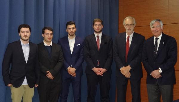 Adm. Rodolfo (r) and Jose Carlos Alves, faculty adviser and professor, FEUP (2nd from r), present the new Porto Student Chapter board members at the May meeting. They include (from l) Nuno Neto, secretary; Rodrigues, second vice president; Ranito, president; and Moreira, first vice president.