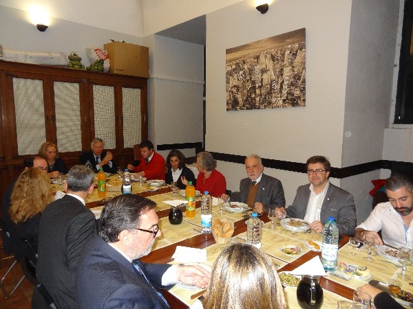 Members and their families gather for a New Year's dinner.