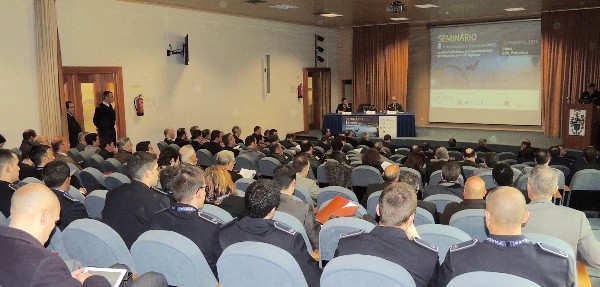 In February, the audience listens to a panel discussion during the seminar.