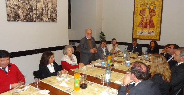 Rear Adm. Mario C. Durao, PRT NA (Ret.), chapter president (standing), reflects on the chapter's achievements of 2016 at a New Year's dinner.