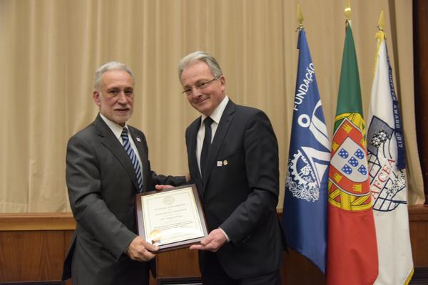 Maj. Gen. Erich Staudacher, GEAF (Ret.), general manager of AFCEA Europe (r), presents the 30th anniversary charter to Chapter President Rear Adm. Mario Durao, PRT N (Ret.), during a February ceremony.