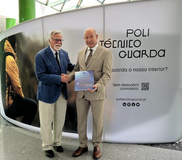 Adm. Rodolfo presents a commemorative AFCEA book to Francisco Brigas, president of the Polytechnic Institute of Guarda, in May.