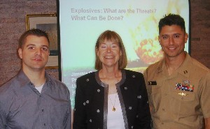 Discussing explosives are (l-r) Capt. Alan White, Joint Forces Head Quarters, Rhode Island National Guard; Professor Jimmie C. Oxley University of Rhode Island; and Lt. Rudy Schoen, USN, officer in charge, Explosive Ordnance Disposal Mobile Unit Two.  