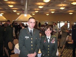 Lt. Col. Christine Harvey, USA, professor of military science at the University of Connecticut, congratulates Cadet Prescott at the April chapter awards luncheon. 
