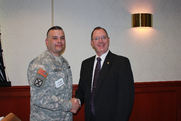 Lt. Col. Rob Castillo (l), USA, chief of plans,106th Signal Brigade accepts the chapter's gratitude from Dave Geuting, vice president for programs. 