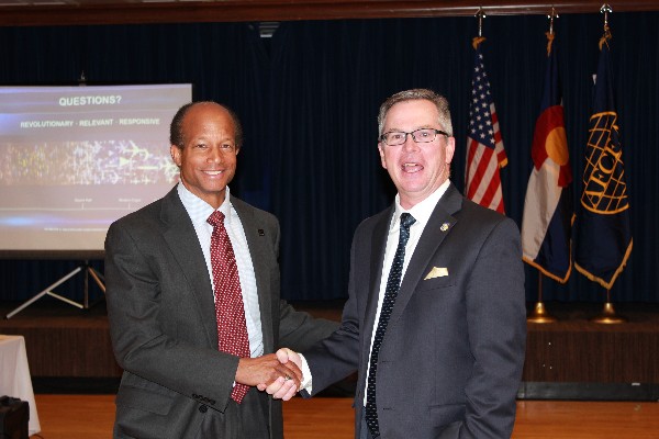 Guest speaker David Blanks (r), Air Force Research Labs (AFRL) liaison to Air Force Space Command and the Air Force Tactical Applications of National Capabilities (TENCAP), accepts the chapter's gratitude from Chapter President Bob Wright (l) at the luncheon in October. 