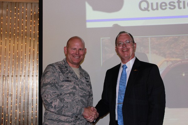 Guest speaker Col. Gary Cornn, USAF, commander, 721st Mission Support Group, accepts the chapter's gratitude from Dave Geuting (r), vice president for programs, at the luncheon in November. 