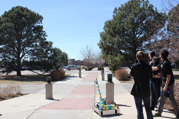 T-Rex—a remotely piloted robot created by the Rocky Mountain Robotics team—launches a T Shirt across the parking lot in March.