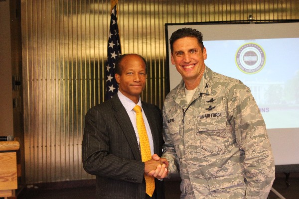 Col. Wright (l) thanks Col. Donovan Routsis, USAF, deputy director, Integrated Air, Space, Cyberspace and ISR Operations, Headquarters Air Force Space Command, for providing an outstanding presentation on the White House Communications Agency structure and missions.