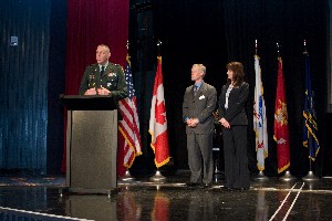 Col. Michael Curry, USA (l), U.S. Northern Command/deputy J-6, and chapter president, welcomes attendees to the cyberspace symposium, held in January, before introducing Mike Clark, cyberspace symposium chair, and Anne Marshall, deputy chair for the symposium.