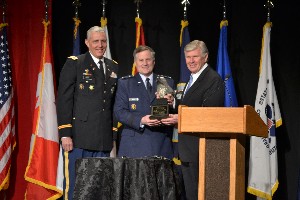 In February, Lt. Gen. William T. Lord, USAF (c), chief of warfighting integration and chief information officer, Office of the Secretary of the Air Force Center, receives the North American IT Leadership Award from Lt. Gen. Harry D. Raduege, USAF (Ret) (r), and Col. Michael J. Curry, USA, chapter president.