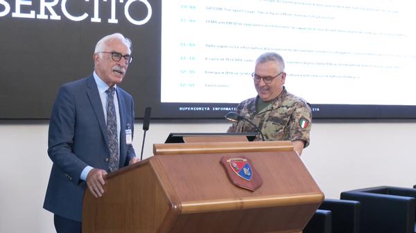 Lt. Gen. Antonio Tangorra, chapter president, introduces Brig. Gen. Francesco Modesto, commander of the Italian Army Signal Command, at the July conference.