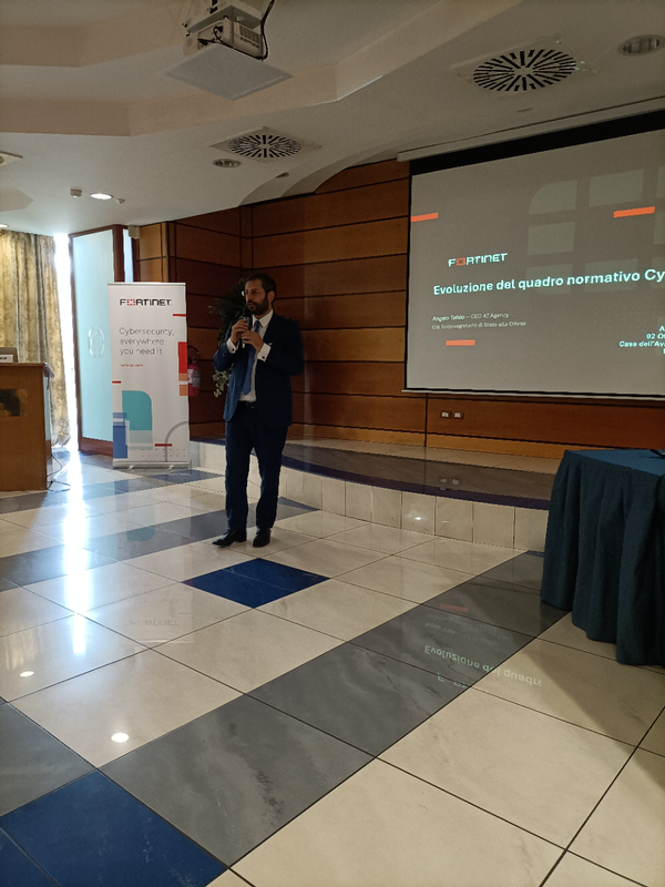 Angelo Tofalo, CEO of AT Agency, presents at the October conference.