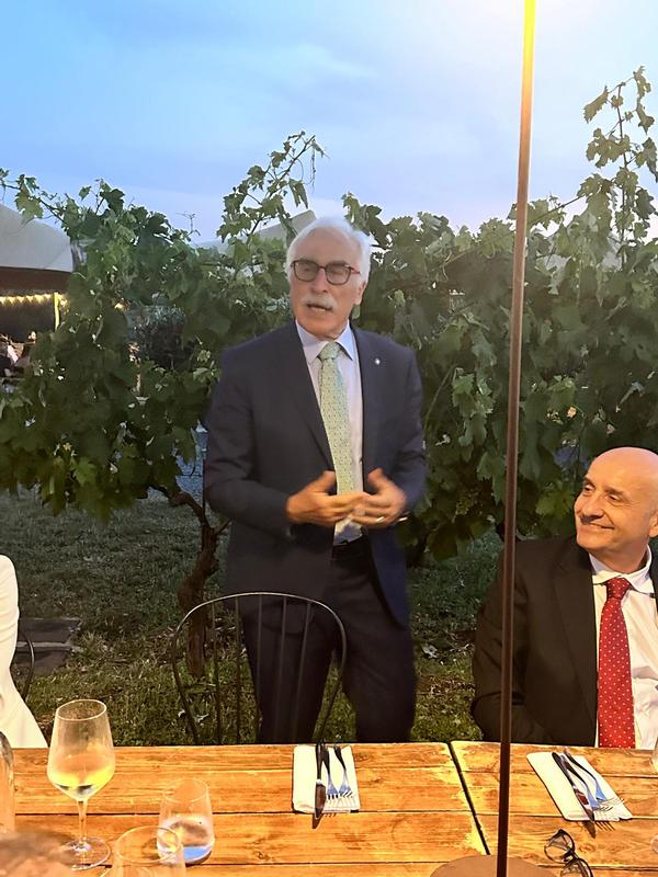 Lt. Gen. Antonio Tangorra, ITAF (Ret.) speaks, as Rear Adm. Massimo Esposito looks on during the June event.