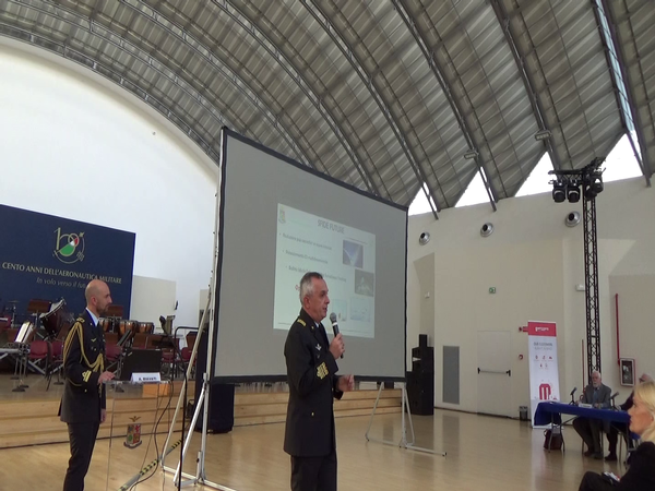 Lt. Gen. Alberto Biavati, commander of Air Fleet Command, presents as Magg. Stefano Biancone stands by during the November conference.