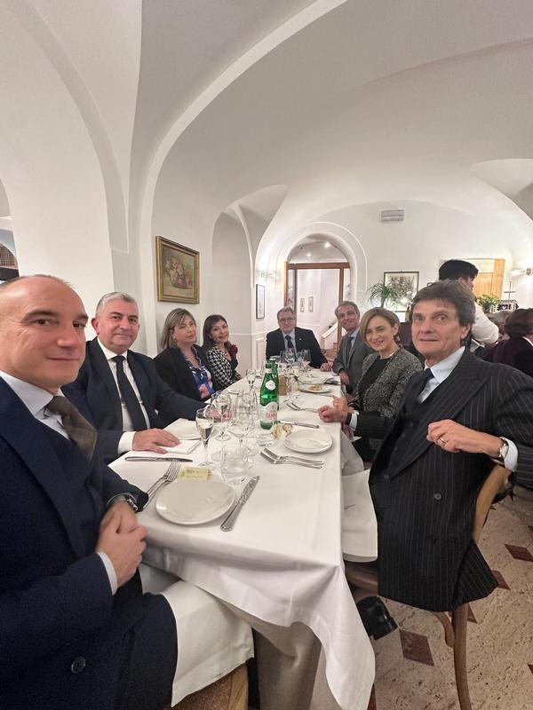Dinner guests pause for a photo at the December event. 
