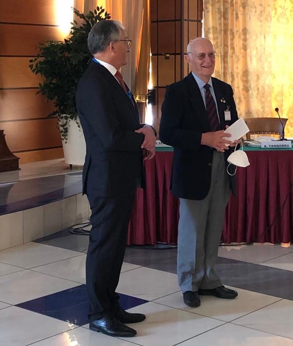 At the October meeting, Gen. Staudacher presents Lt. Gen. Luigi Campagna (Ret.), with an award for more than 25 years of membership.