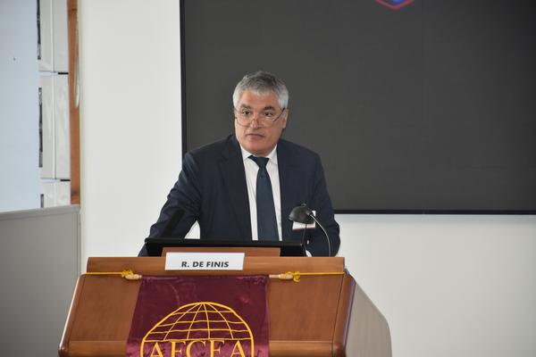 In July, R. De Finis gives a speech at the conference in Rome.