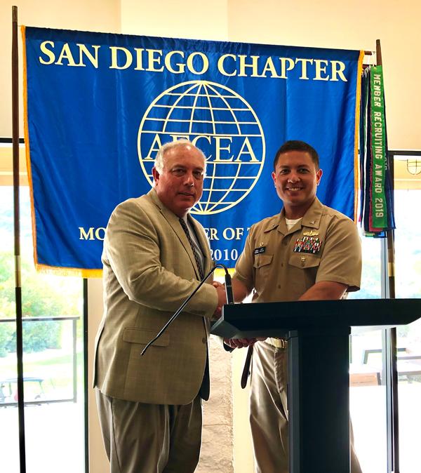 Chapter President Gary Brister (l) thanks Capt. Khary W. Hembree-Bey, USN, commanding officer of Naval Surface Warfare Center, Corona Division, for speaking at the chapter's November luncheon.