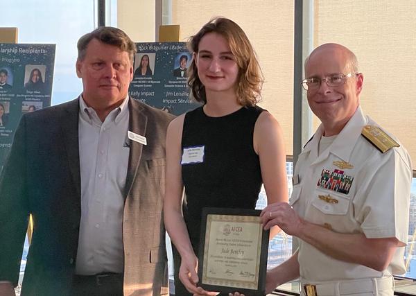 Jade Bentley receives an AFCEAN-Dependent certificate and award in August.