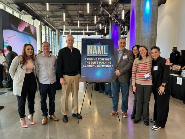 In March, the Naval Applications of Machine Learning (NAML) team poses for a photo. (from l-r) Juanita Hunt, Naval Information Warfare Center (NIWC) Pacific (PAC); Mike Tall, NIWC PAC; Adm. Small; Carl Mills, partner  and  CEO, CaVU Consulting Inc.; Nicole Isoda, NIWC PAC, NAML co-chair; Katie Rainey, director of Science and Technology, NIWC PAC; and Stephanie Luna, NIWC PAC.