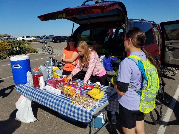 The support crew provides drinks and snacks to participants raising money for STEM scholarships in April.