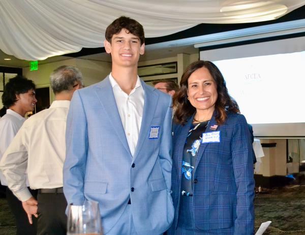 Student scholarship recipient, Ryan Rodrigue, and Ana Olsen, chapter executive vice president and incoming president, pause for a photo at the April event. 