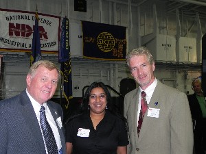 At the March luncheon, Jim Loiselle (l), chapter president, and Joe Bulger, chapter vice president for small business, present Nisa Mehta, Lockheed Martin Corporation, with the AFCEAN of the Month award.