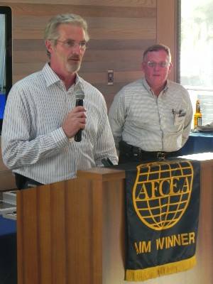At a reception in August, Joe Bulger, Lockheed Martin, addresses the chapter after receiving an appreciation letter for being a platinum sponsor of the 2010 C4ISR Symposium.