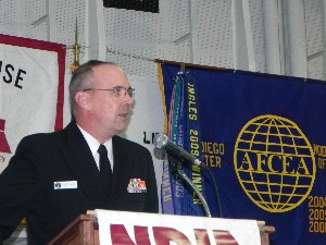 Rear Adm. C. Forrest Faison III, USN, commander, Navy Medicine West and Naval Medical Center San Diego, addresses attendees aboard the USS Midway at the chapter's March meeting.