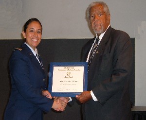Dan Washington, chapter president, presents Cadet Mercedes Flores, Air Force ROTC, with the chapter's ROTC Honor Award and a ribbon bar at the June awards ceremony.