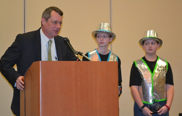 In February, Jeff Gulick (l), Da Ex Bots team coach, along with team leads Jenna and Jake Gulick, reports on the successful 27-team competition and thanks the chapter for its $1,000 STEM grant enabling the rescheduling of the Southern IL FIRST Lego League tournament due to weather cancellation.