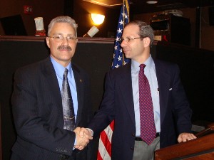 Nathan Colodney, chapter president (r), thanks Daniel Q. Bradford, director of Enterprise Systems Technology Activity, senior technical director/chief engineer, Network Enterprise Technology Command (NETCOM)/9th Signal Corps (Army), for being the featured speaker at the chapter's luncheon in April.