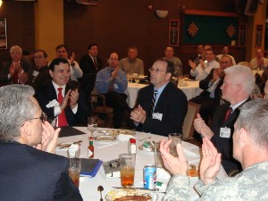 Attendees at the chapter's April luncheon express appreciation for guest speaker Bradford.